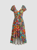 Bella bold circle print high-low dress — vibrant red, teal and orange abstract pattern, front view on white background.