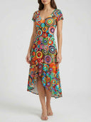 Bella multicolour abstract circle print high-low mini dress with V-neck and cap sleeves, front view on white background.