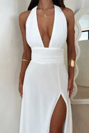 White maxi dress with deep V-neck, cinched waist, and thigh-high slit, front view.