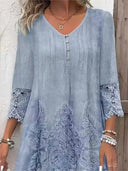 Light blue V-neck mini dress with lace sleeves and embroidered pattern, front view.