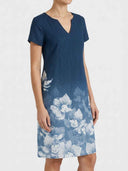Charlotte Floral V-Neck Midi Dress in navy blue, angled front view showing relaxed A-line silhouette and large-scale floral hem print.