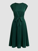 Dark green Ciara Pleated Cap Sleeve Midi Dress, straight-on front view showing round neckline, self-tie bow waist belt, structured cap sleeves, and fully pleated A-line midi skirt.