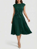 Close front view of dark green Ciara Pleated Cap Sleeve Midi Dress highlighting structured cap sleeve detail and fully pleated A-line midi skirt.