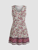 Cleo sleeveless V-neck floral mini dress in deep berry and ivory botanical print with contrast paisley border hem, front view on grey background.