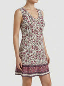 Cleo floral mini dress, ivory base with berry botanical print and contrast paisley border hem, angled side view showing A-line silhouette.