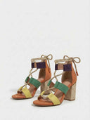 Pair of colourblock block heel sandals with rope lacing and woven raffia-texture heel, angled view on white background.