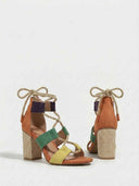 Angled pair view of colourblock strappy heeled sandals with rope ankle tie and woven chunky heel on white background.
