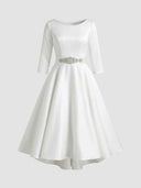 Daisy white A-line midi wedding guest dress with boat neckline, three-quarter sleeves, rhinestone jewelled belt and high-low skirt, front view.
