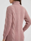 Back detail of the Daisy pink cable-knit mini dress showing the mixed cable-and-rib knit panel texture across the body and sleeves.