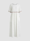 White relaxed maxi dress with embroidered waistband and short elbow-length sleeves, front view.