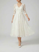 Daisy ivory floral appliqué V-neck midi dress, full A-line silhouette with tulle skirt, front view on white background.