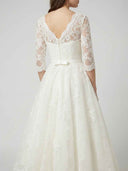 Daisy ivory floral appliqué midi dress with V-neck, three-quarter sheer sleeves, and satin bow belt back detail, rear view.