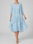 Daisy floral embroidered midi dress and matching chiffon jacket set in sky blue, styled front view.