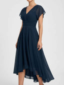 Daisy navy flutter sleeve V-neck high-low midi dress, ruched empire waist and A-line skirt, angled front view.