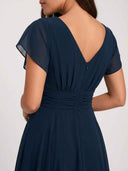 Daisy navy flutter sleeve midi dress, V-back neckline and ruched waist detail, back view.