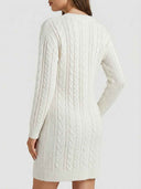 White cable-knit long sleeve mini jumper dress — back view showing full cable texture and ribbed cuffs.