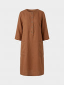 Daisy relaxed shift dress in brown woven, partial button placket, three-quarter roll-tab sleeves and two front patch pockets, front view on white background.