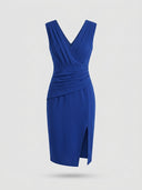Royal blue sleeveless V-neck ruched bodycon midi dress with side slit, front view on white background.