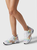 Cushioned women's trainer in Mixed colourway — pastel rainbow mesh and white leather-look panels with chunky white midsole, angled side view.