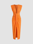 Orange midi dress with deep V-neck, ruched waist, and front slit, front view on a white background.