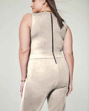 Champagne sleeveless belted blazer jumpsuit with black back zipper, angled back view.