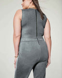 Gray sleeveless jumpsuit with black back zipper, angled back view.