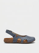 Dark blue closed-toe slingback sandals with cork footbed and velcro slingback strap, side view.