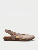 Pink closed-toe slingback sandals with cork flatform sole and scalloped cutout vamp, side view.