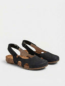 Black closed-toe slingback sandals with cork sole and velcro strap, angled view on white background.