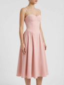 Delilah blush pink sweetheart midi dress showing gathered A-line skirt volume and structured corset bodice, front view.