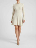 Cream ribbed long-sleeve midi dress with flared skirt, front view on model.