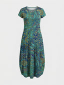 Teal and blue patterned mini dress with short sleeves and round neck, front view on white background.