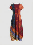 Multicolor patchwork mini dress with short sleeves and circular patterns, front view.