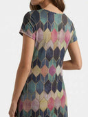 Long sleeve mini dress with multicolor geometric pattern, back view.