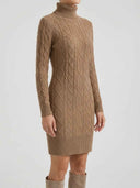 Tan cable knit turtleneck mini dress with ribbed cuffs and hem, front view.