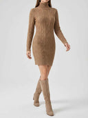 Tan cable knit turtleneck mini dress with long sleeves, front angled view on a model.