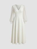 White V-neck midi dress with sheer long sleeves and three buttons on bodice, front view.