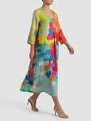 V-neck midi dress with colorful brushstroke pattern, angled side view.