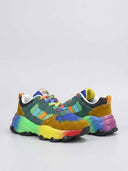 Pair of chunky low-top trainers with rainbow gradient midsole, angled side view showing lace-up closure.
