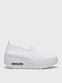 White slip-on platform knit trainer with mesh upper and air-cushion sole, side view.