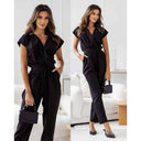 Black tie-waist jumpsuit with V-neck and short sleeves, front view on a light background.