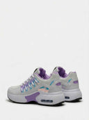 Close-up detail shot of the iridescent holographic panel and flat white laces on chunky women's fashion trainers.