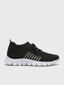 Black mesh lace-up trainer with white segmented cushioned sole, side view on white background.