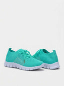 Pair of turquoise mesh lace-up trainers with white cushioned soles, angled view showing both shoes.