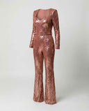 Rose gold sequin jumpsuit with long sleeves, square neckline, and belted waist, angled view.