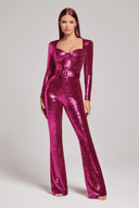 Fuchsia sequin jumpsuit with long sleeves, square neckline, and matching belt, front view.