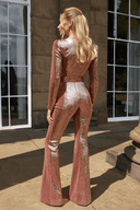 Rose gold sequin jumpsuit with long sleeves and flared legs, angled back view.