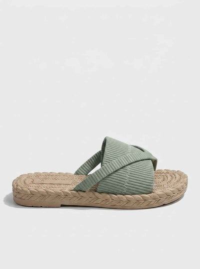 Sage green crossover knit slide sandals with espadrille rope-trim sole — side profile on white background.