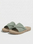 Flat crossover slide sandal with espadrille sole in green — full side profile view.