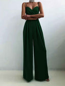 Dark green spaghetti strap overall with flared hem, front view on a white background.